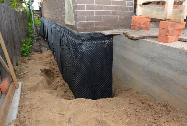 Happy homeowners after waterproofing job in Lake Elmo